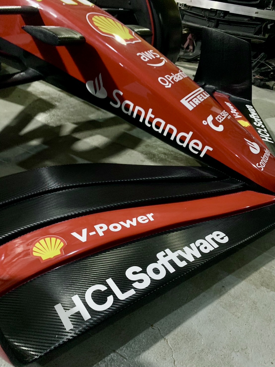 Close-up of finished composite wings and painted bodywork on a full-scale display car